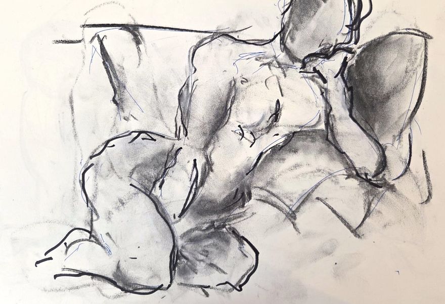 Life drawing of a reclining nude male figure, made from life in charcoal and ink.